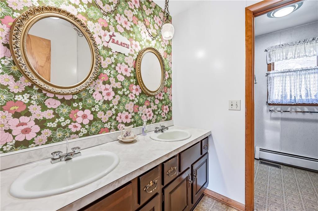 2635 South Keel Ridge Road Hermitage, PA 16148 - Photo 20 of 49 a bathroom with a sink and a mirror