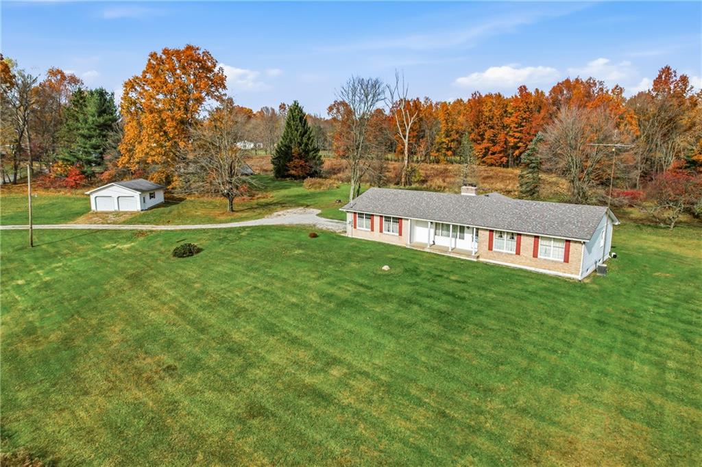 2635 South Keel Ridge Road Hermitage, PA 16148 - Photo 2 of 49 a view of a garden with a building in the background