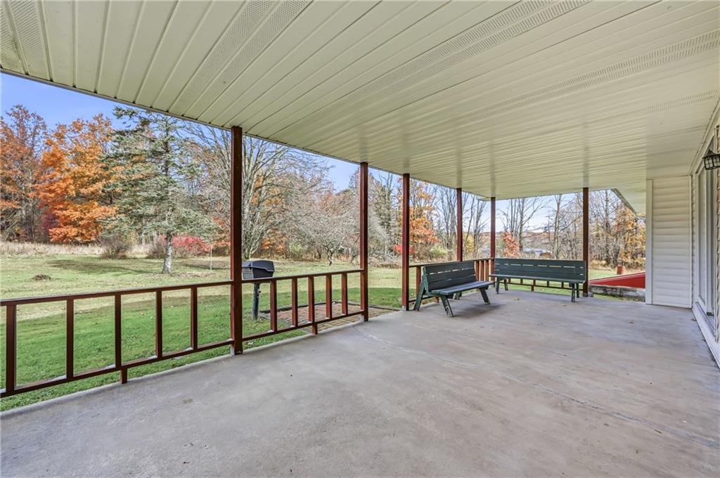 2635 South Keel Ridge Road Hermitage, PA 16148 - Photo 6 of 49 an empty room with sliding glass door and outdoor space
