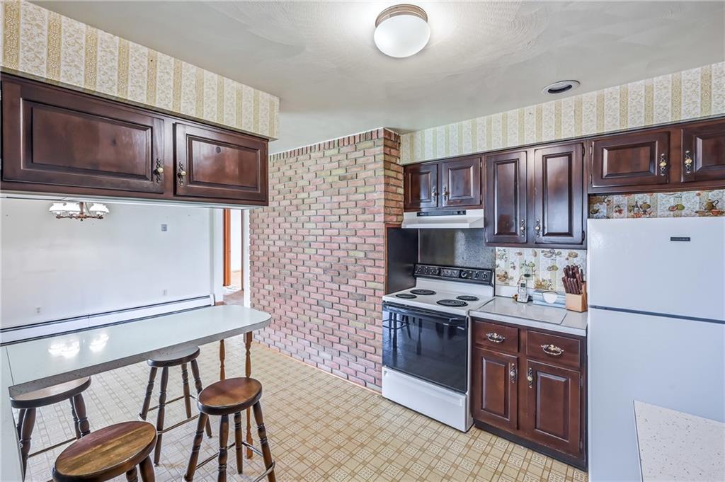 2635 South Keel Ridge Road Hermitage, PA 16148 - Photo 9 of 49 a kitchen with stainless steel appliances granite countertop a stove top oven a refrigerator a sink and dishwasher