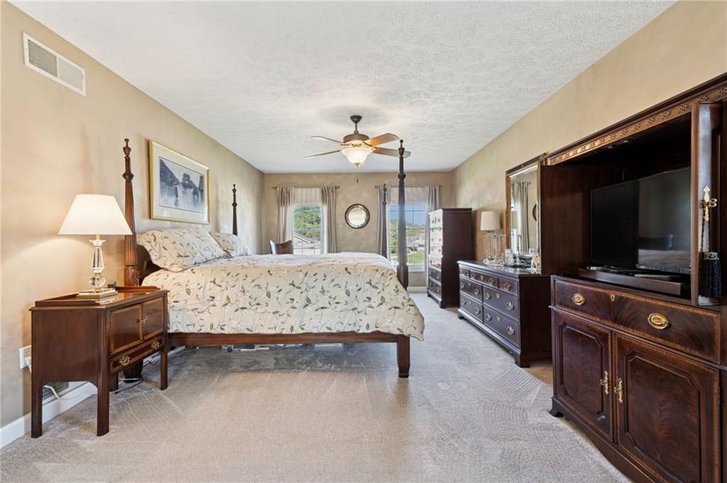 188 Meadow Spring Road Greensburg, PA 15601 - Photo 18 of 43 a bedroom with a bed and a flat screen tv