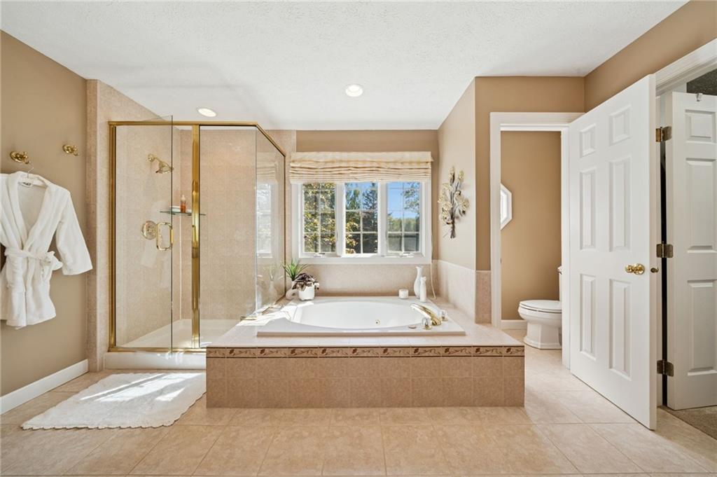 188 Meadow Spring Road Greensburg, PA 15601 - Photo 20 of 43 a living room with large window and a chandelier