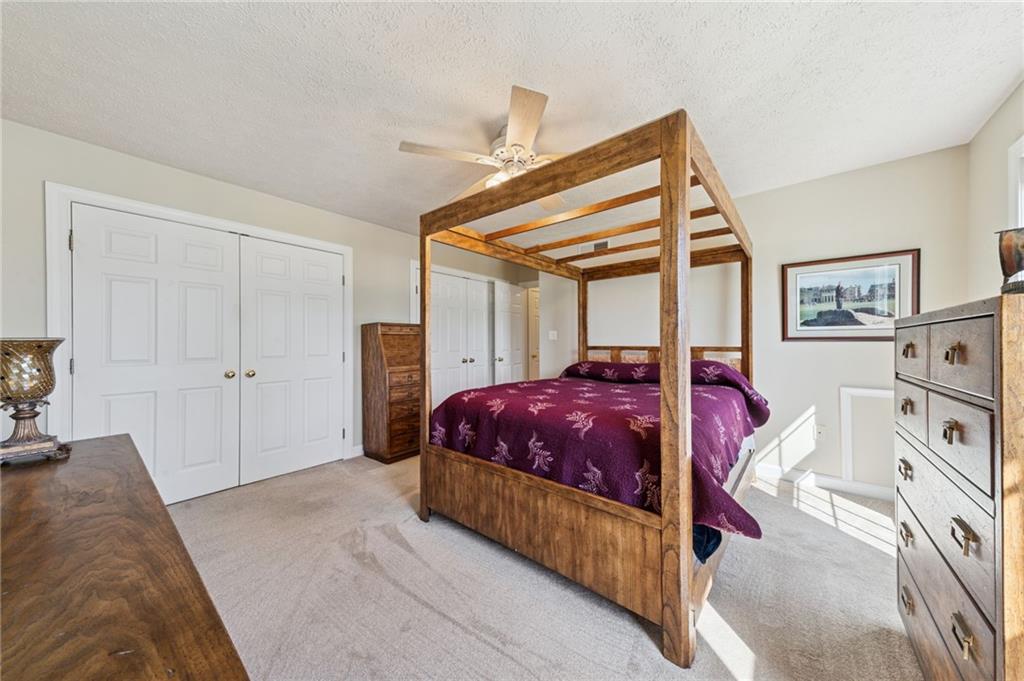 188 Meadow Spring Road Greensburg, PA 15601 - Photo 24 of 43 a spacious bedroom with a bed and a large closet