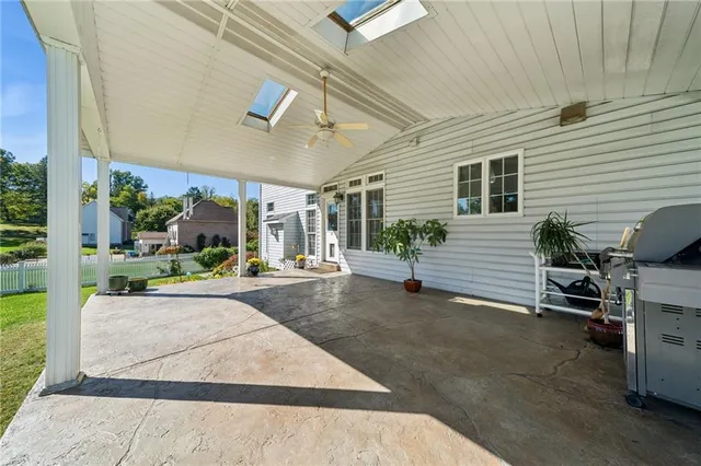 a view of yard with swimming pool and outdoor seating