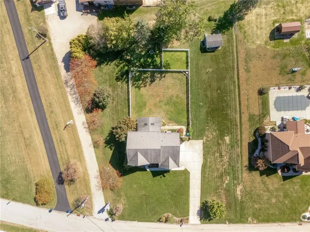 an aerial view of a house with a lake view
