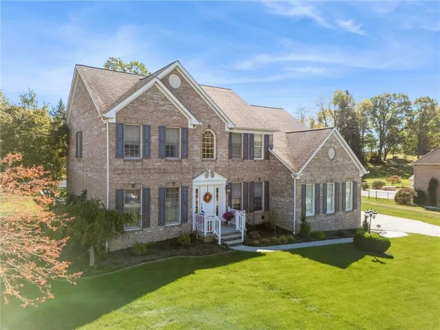 a house view with a garden space