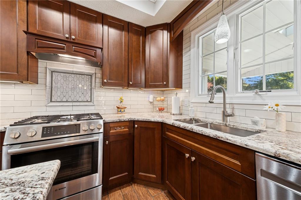 188 Meadow Spring Road Greensburg, PA 15601 - Photo 8 of 43 a kitchen with a sink stove and cabinets