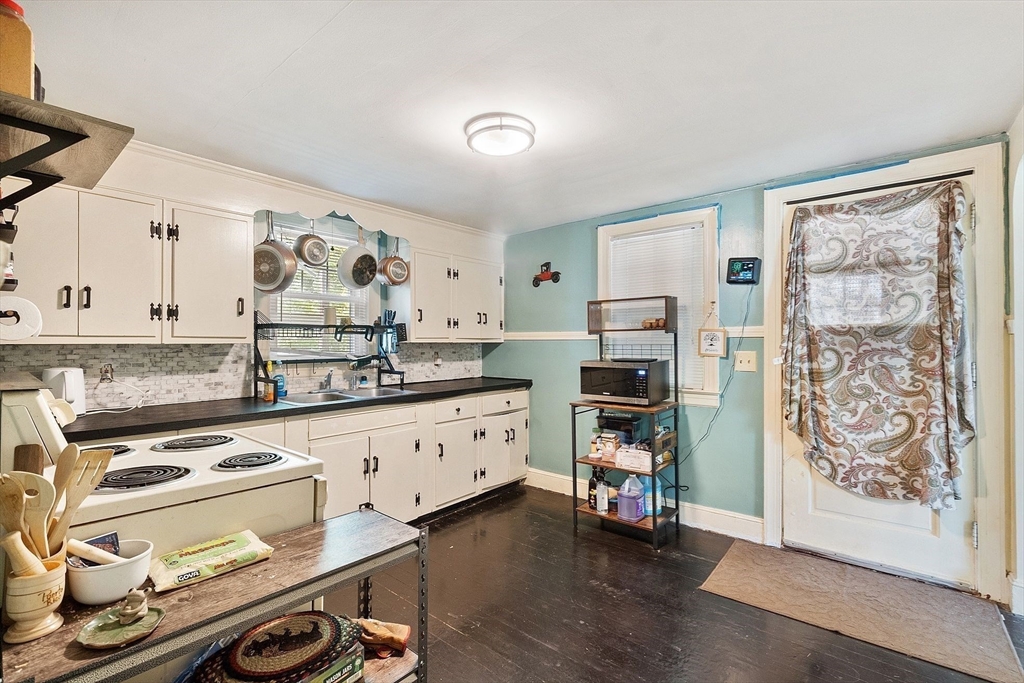 29 Warwick Road Gardner, MA 01440 - Photo 11 of 31 a kitchen with stainless steel appliances a stove a sink and a refrigerator