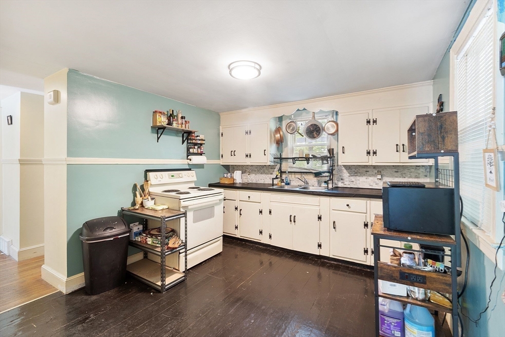 29 Warwick Road Gardner, MA 01440 - Photo 12 of 31 a kitchen with granite countertop white cabinets and white appliances