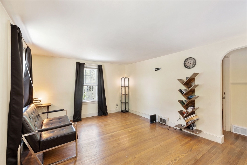 29 Warwick Road Gardner, MA 01440 - Photo 16 of 31 an empty room with wooden floor and windows