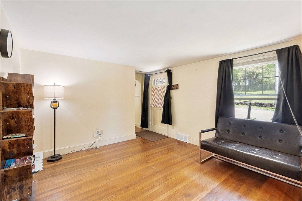 29 Warwick Road Gardner, MA 01440 - Photo 17 of 31 a living room with hard wood floors and a table
