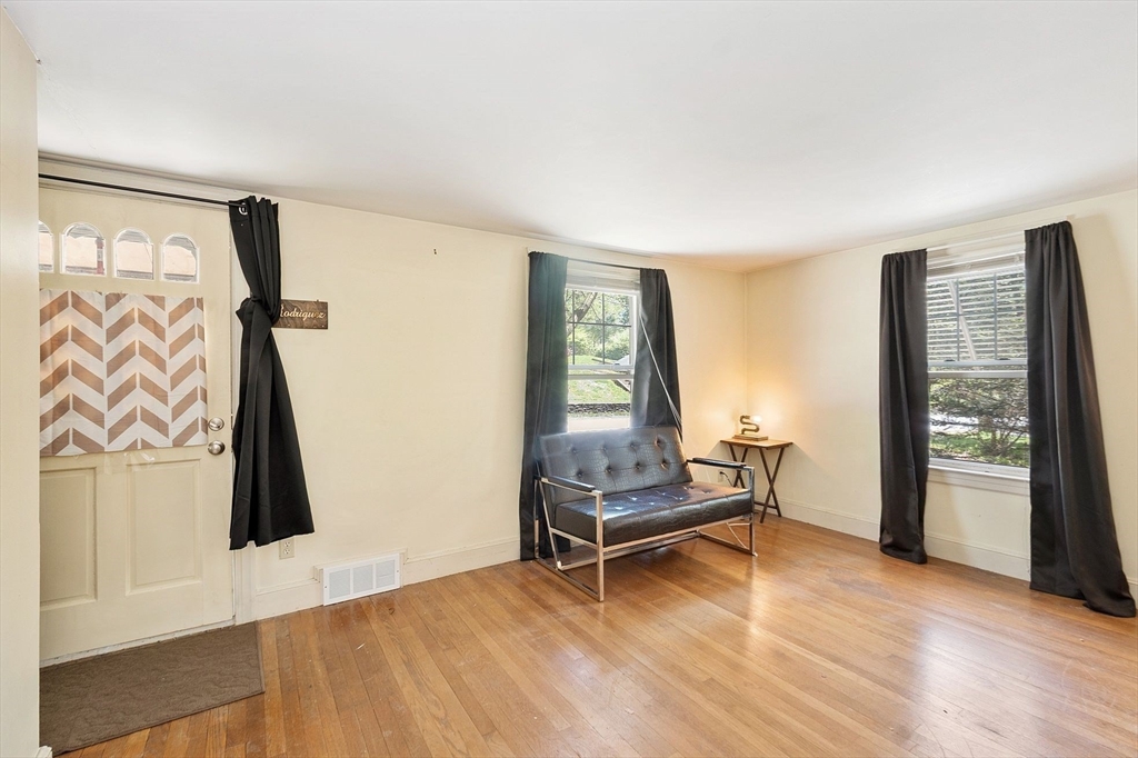 29 Warwick Road Gardner, MA 01440 - Photo 18 of 31 a view of an empty room with window and wooden floor