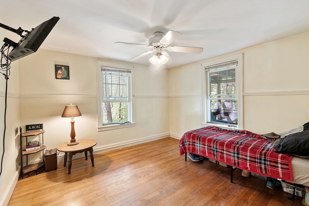 29 Warwick Road Gardner, MA 01440 - Photo 19 of 31 a bedroom with a bed wooden floor and window