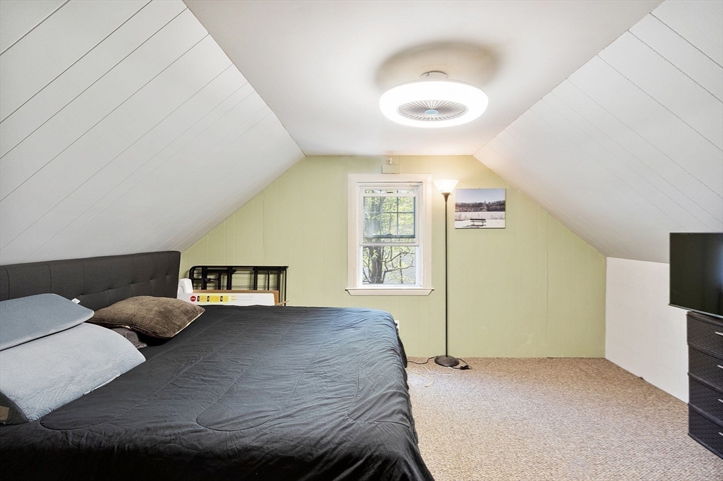 29 Warwick Road Gardner, MA 01440 - Photo 23 of 31 a bedroom with a bed and a flat screen tv