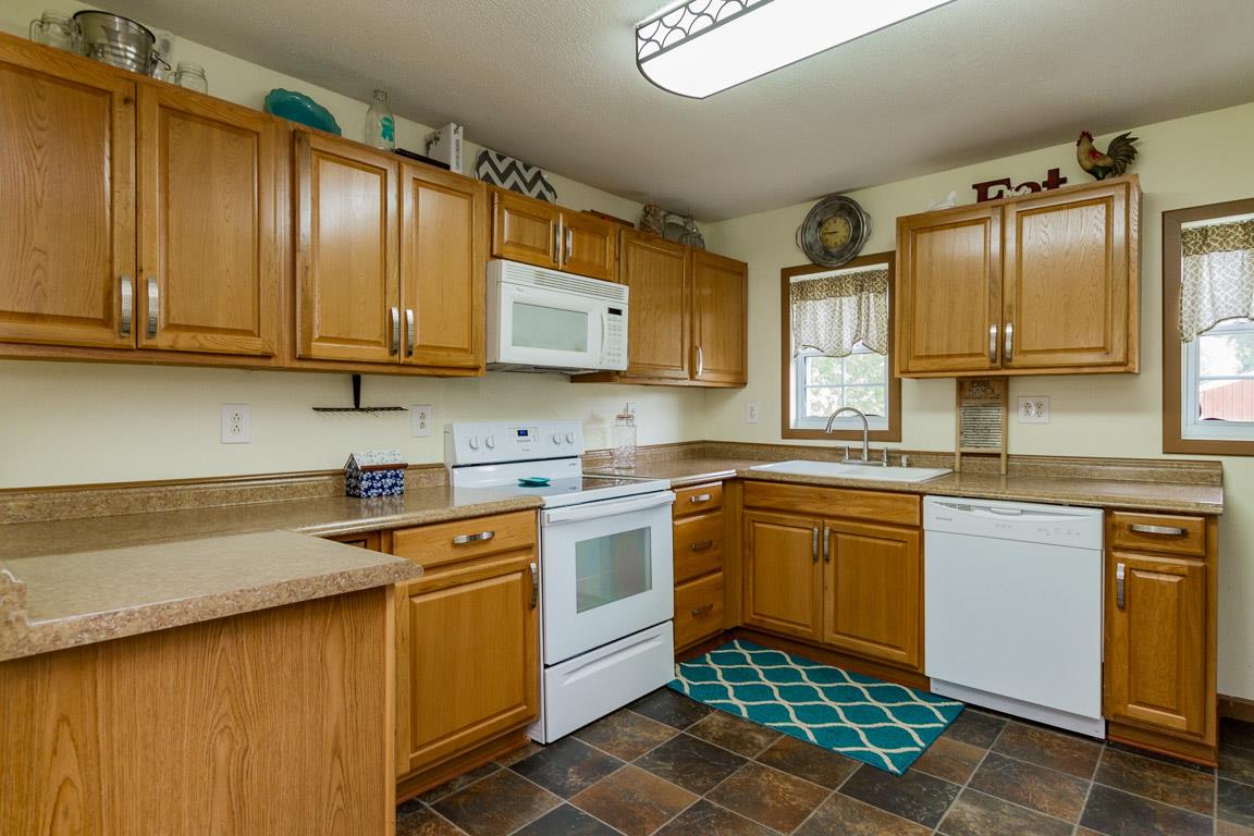 3507 Anderson Road Cedar Hill, TN 37032 - Photo 3 of 30 a kitchen with stainless steel appliances granite countertop a sink stove and cabinets