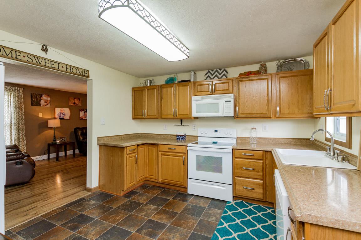 3507 Anderson Road Cedar Hill, TN 37032 - Photo 6 of 30 a kitchen with stainless steel appliances granite countertop a sink and cabinets