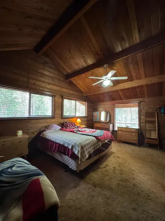 a bed room with bed and window