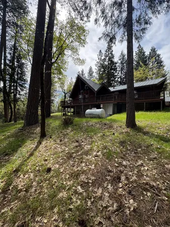 a view of a balcony with trees