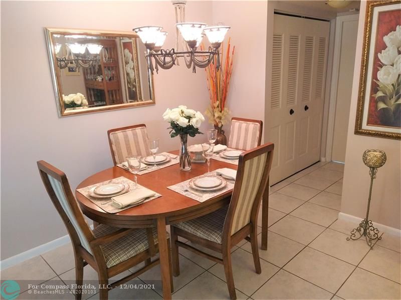 287 Markham M, Unit 287 Deerfield Beach, FL 33442 - Photo 2 of 64 a dining room with furniture and window