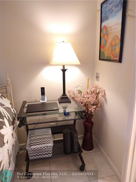 287 Markham M, Unit 287 Deerfield Beach, FL 33442 - Photo 48 of 64 a vase of flowers sitting on a table