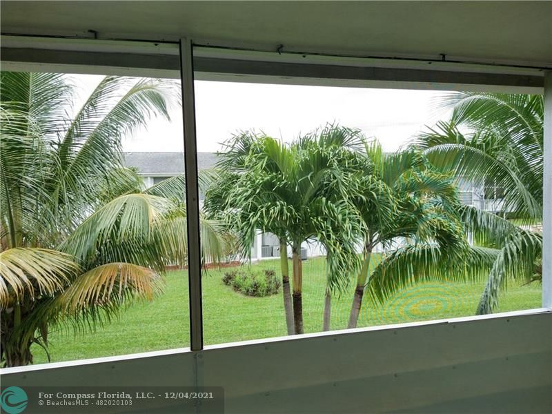 287 Markham M, Unit 287 Deerfield Beach, FL 33442 - Photo 50 of 64 a view of a yard from a balcony
