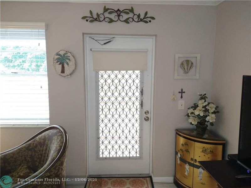 287 Markham M, Unit 287 Deerfield Beach, FL 33442 - Photo 5 of 64 a front view of a house with entryway