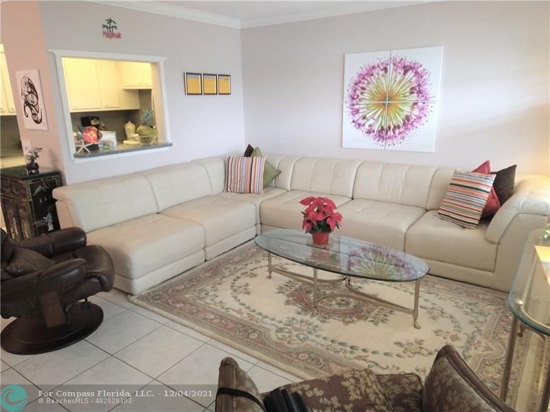 287 Markham M, Unit 287 Deerfield Beach, FL 33442 - Photo 58 of 64 a living room with furniture and a flat screen tv