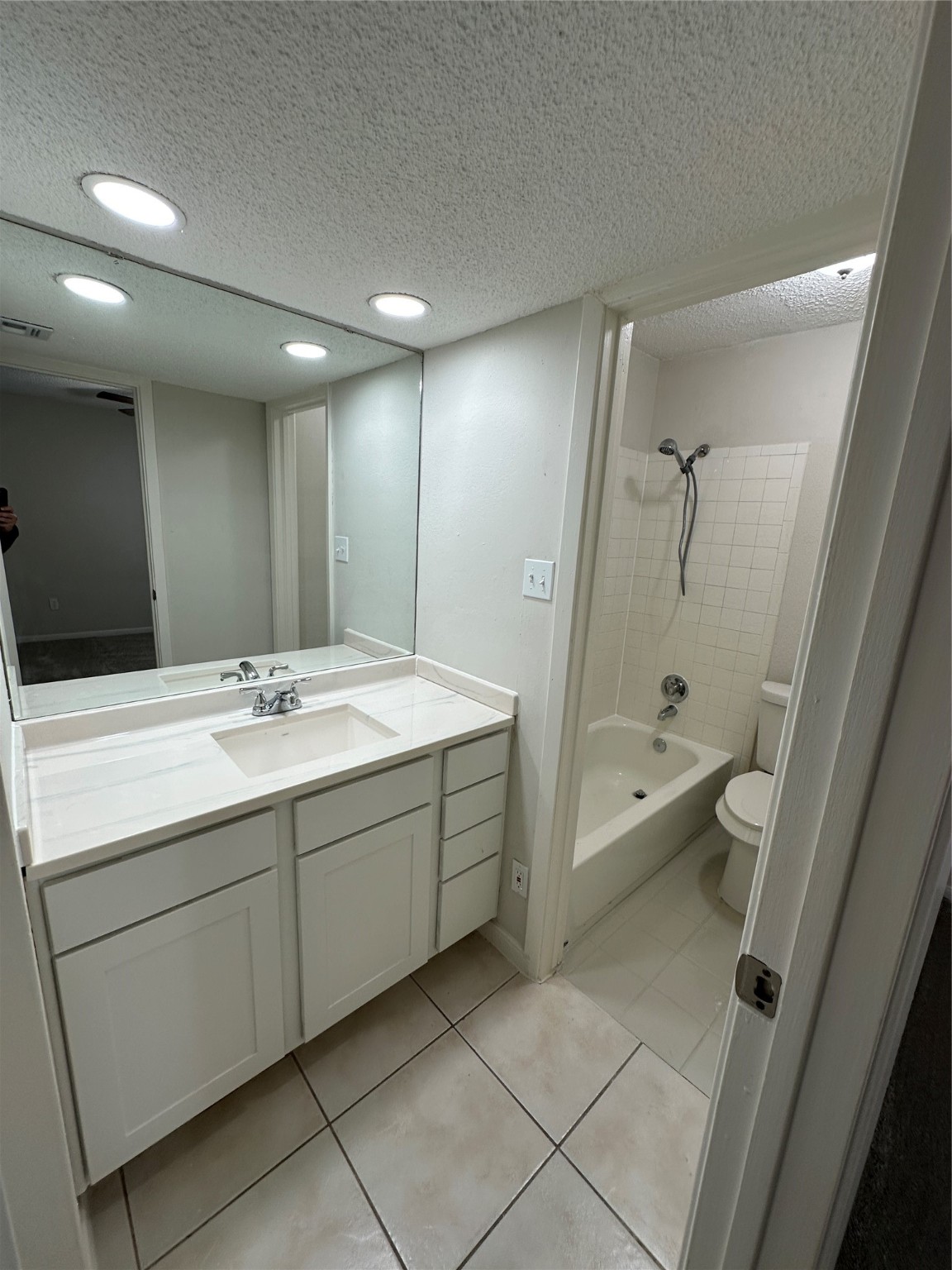 1500 Bay Area Boulevard, Unit 155 Houston, TX 77058 - Photo 12 of 16 a bathroom with a double vanity sink toilet and shower