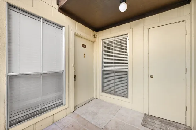 a view of a hallway with closet