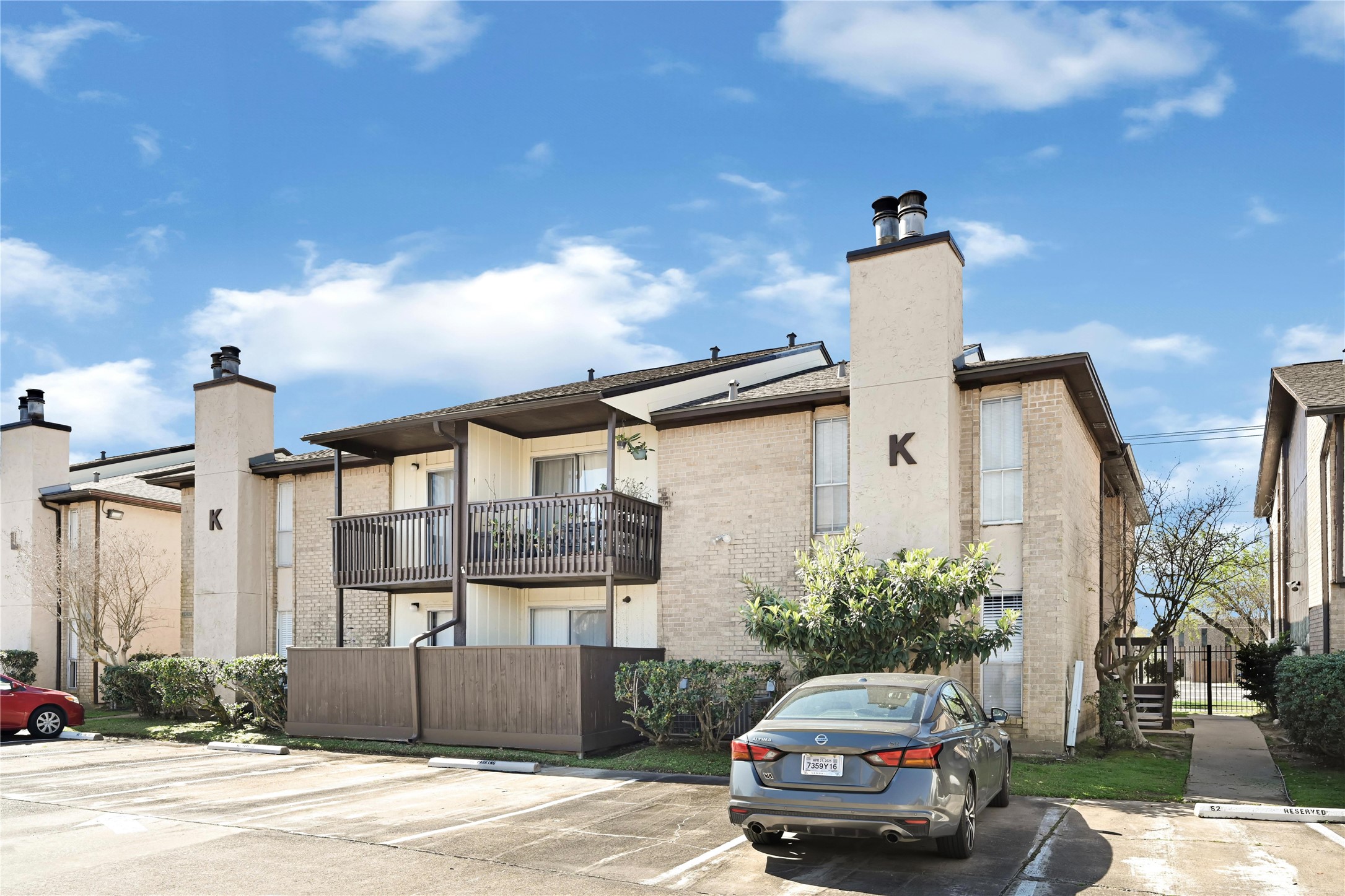 1500 Bay Area Boulevard, Unit 155 Houston, TX 77058 - Photo 15 of 16 a car parked in front of a house