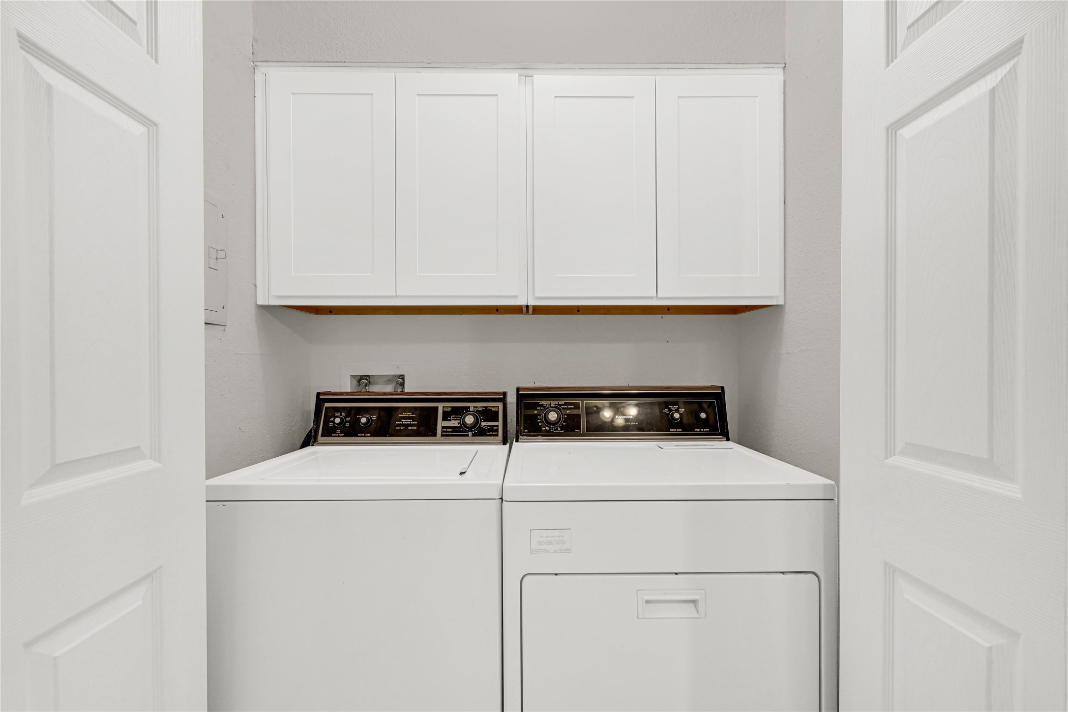 1500 Bay Area Boulevard, Unit 155 Houston, TX 77058 - Photo 9 of 16 a close view of washer and dryer with wooden floor