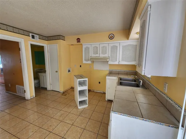 a view of kitchen with furniture and window