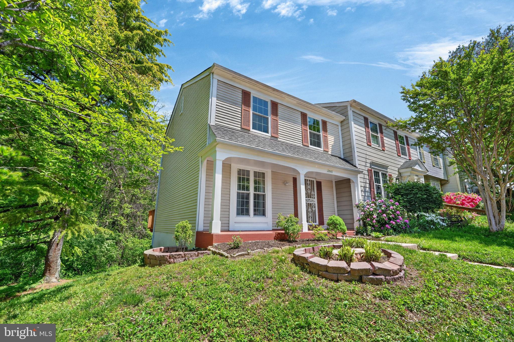 Charming home with lush greenery.