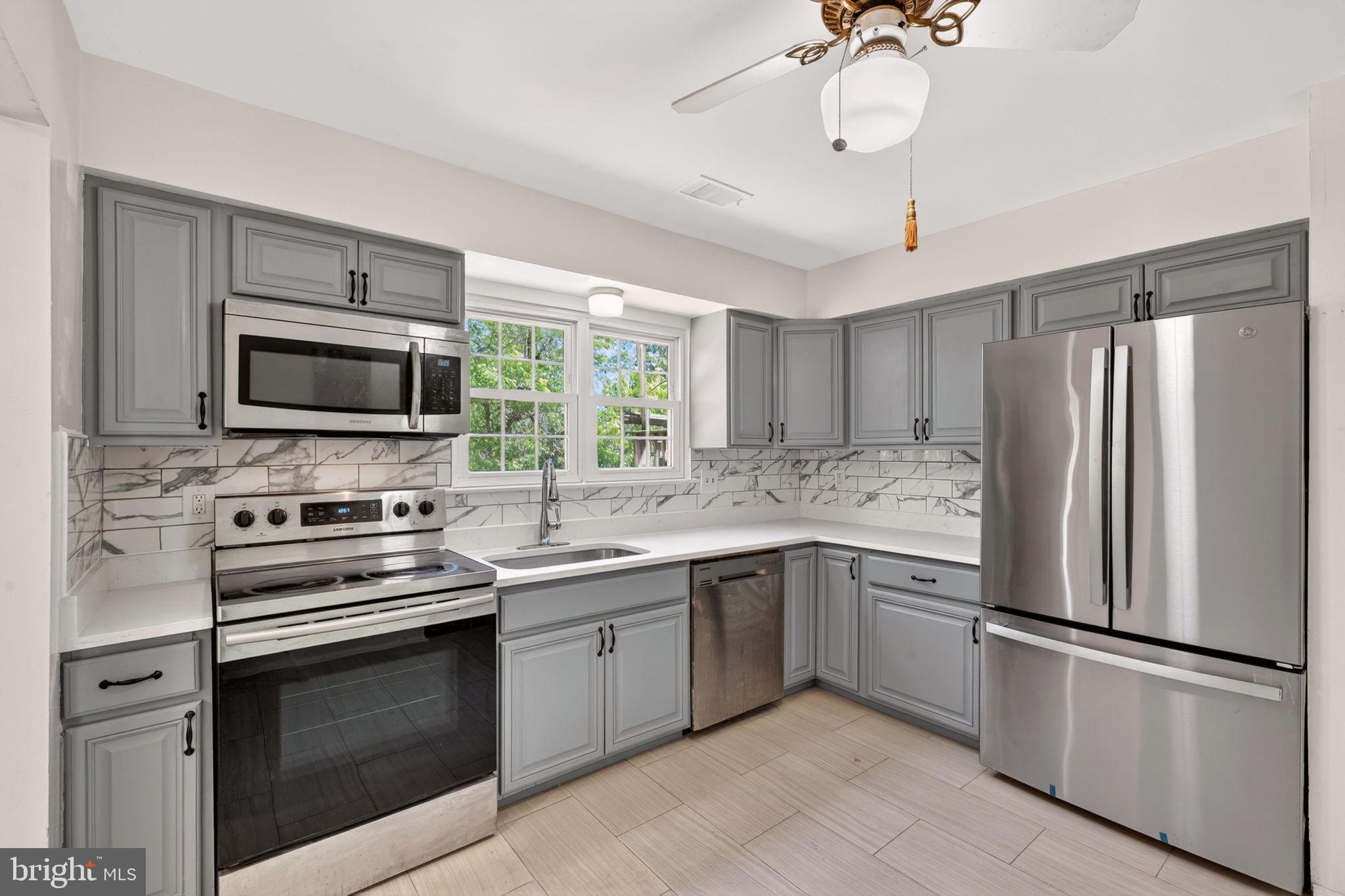 12447 Loft Lane Silver Spring, MD 20904 - Photo 13 of 45 Modern kitchen with sleek finishes.