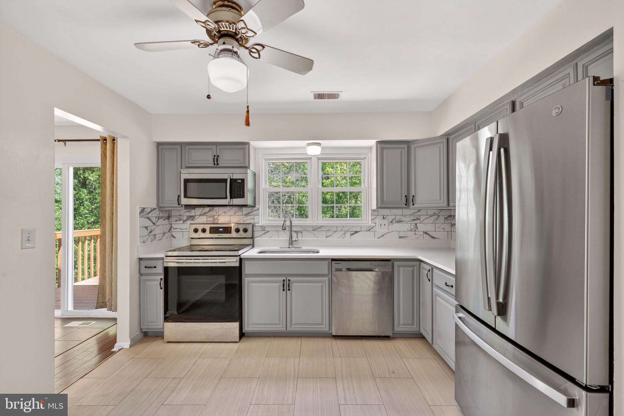 12447 Loft Lane Silver Spring, MD 20904 - Photo 14 of 45 Modern kitchen with sleek finishes.