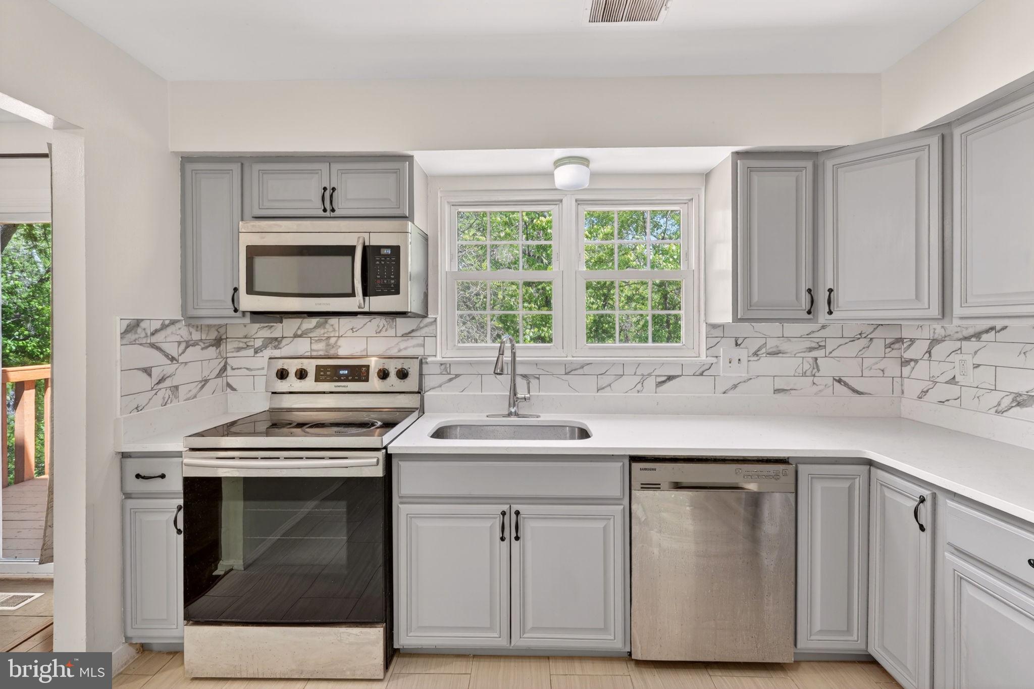 12447 Loft Lane Silver Spring, MD 20904 - Photo 15 of 45 Modern kitchen with sleek finishes.