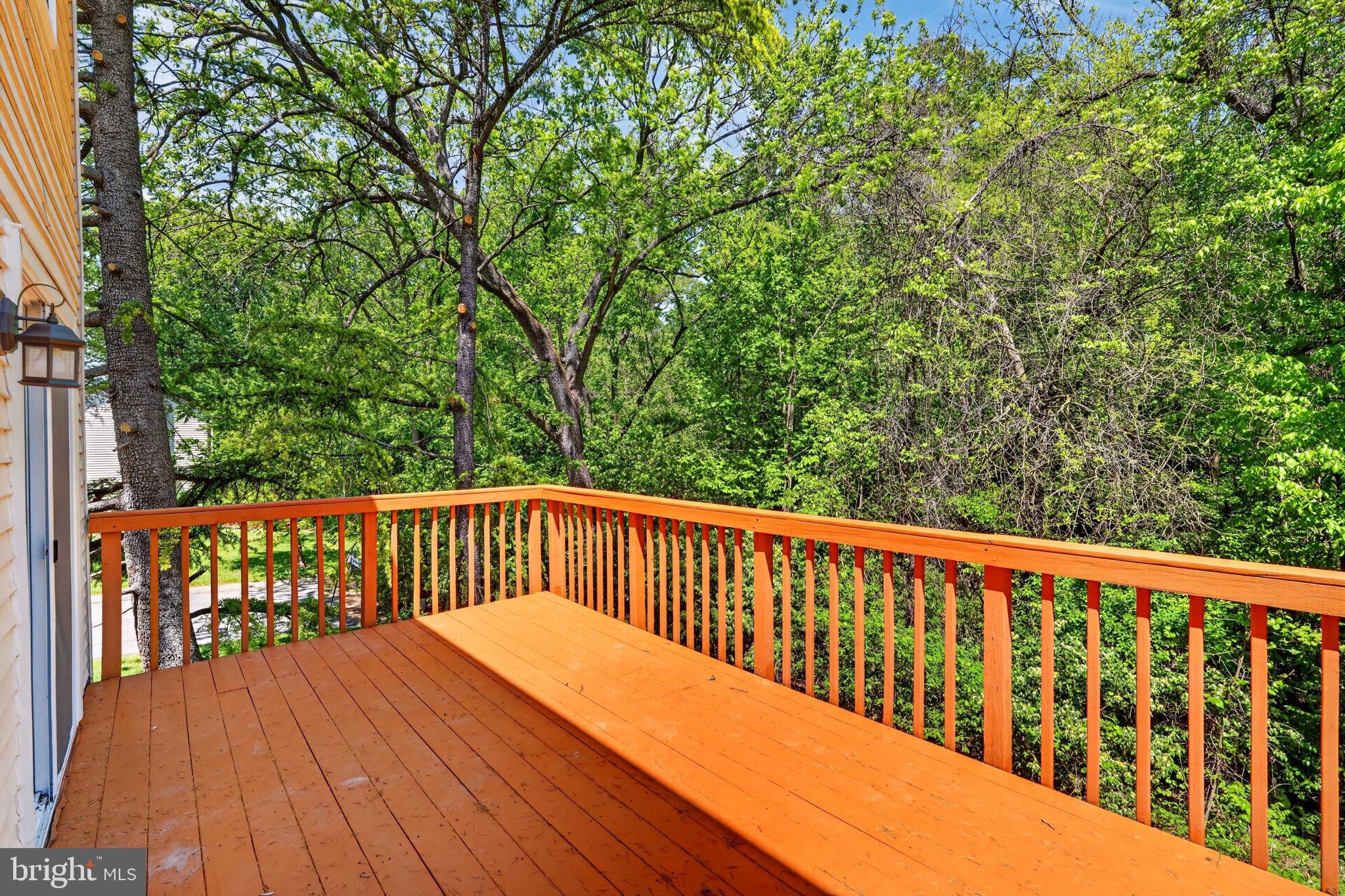 12447 Loft Lane Silver Spring, MD 20904 - Photo 33 of 45 Serene deck embraced by lush greenery.