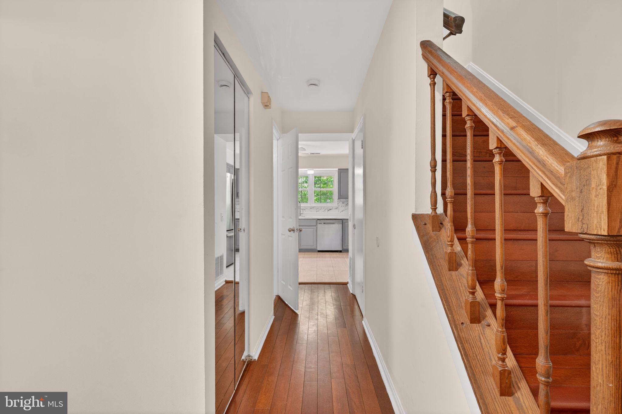 12447 Loft Lane Silver Spring, MD 20904 - Photo 5 of 45 Inviting hallway with warm wood tones.