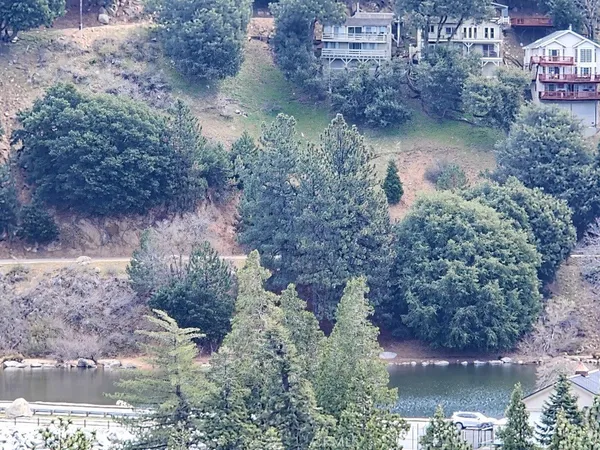 a backyard of a house with yard and lake view