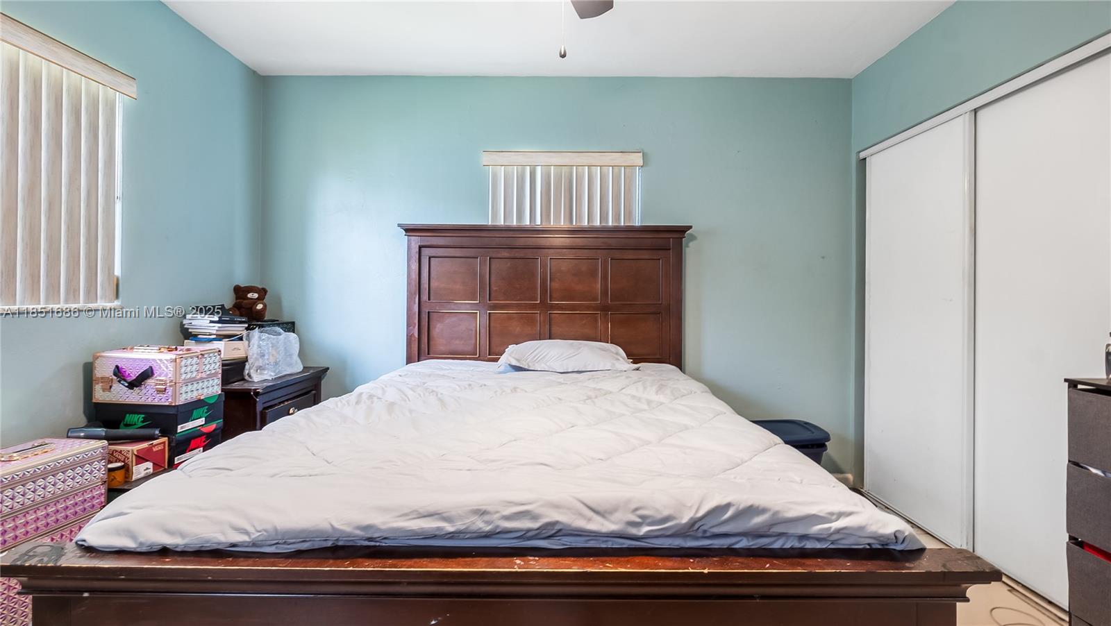 6528 Southwest 26th Street Miramar, FL 33023 - Photo 15 of 29 a bedroom with a bed and wooden floor