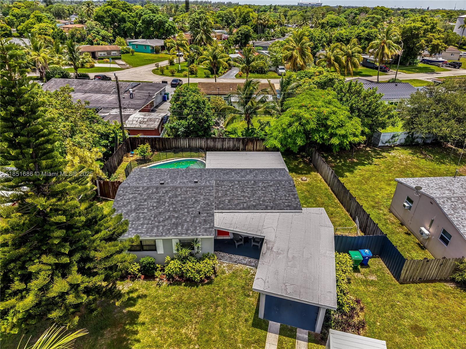 6528 Southwest 26th Street Miramar, FL 33023 - Photo 19 of 29 an aerial view of a house with a garden and swimming pool