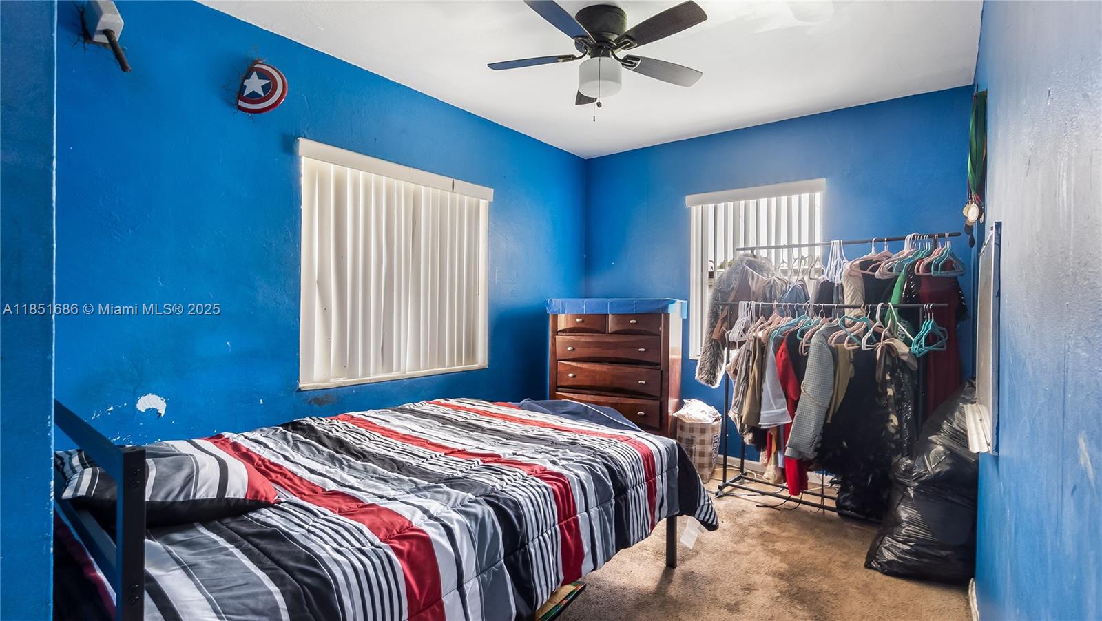 6528 Southwest 26th Street Miramar, FL 33023 - Photo 23 of 29 a bedroom with a bed and a window