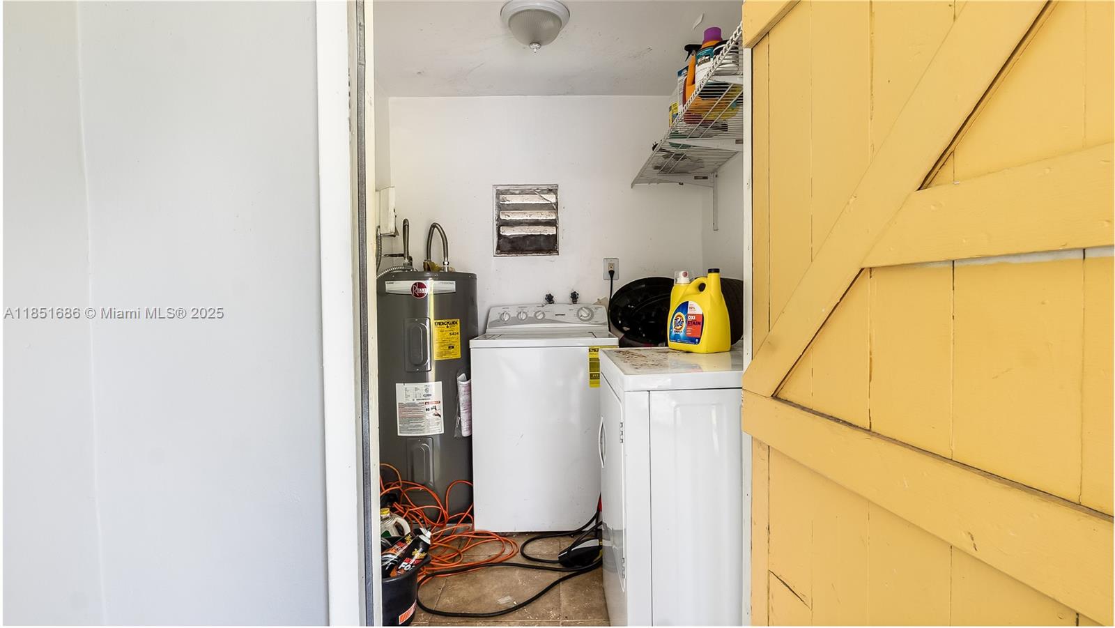 6528 Southwest 26th Street Miramar, FL 33023 - Photo 25 of 29 a utility room with dryer and washer