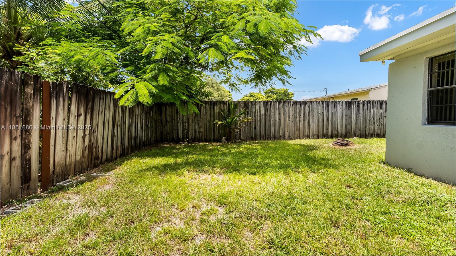 6528 Southwest 26th Street Miramar, FL 33023 - Photo 27 of 29 a view of backyard with garden and wooden fence