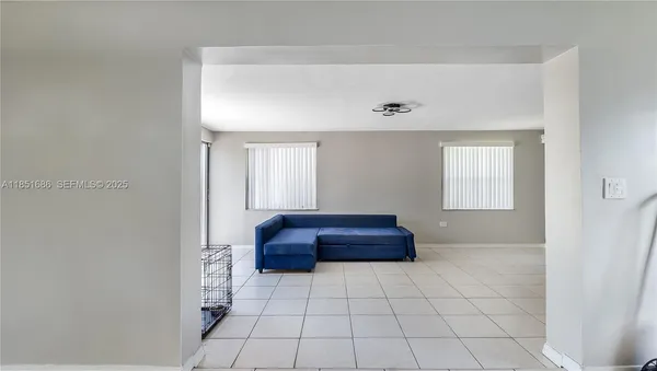 a view of an empty room and window