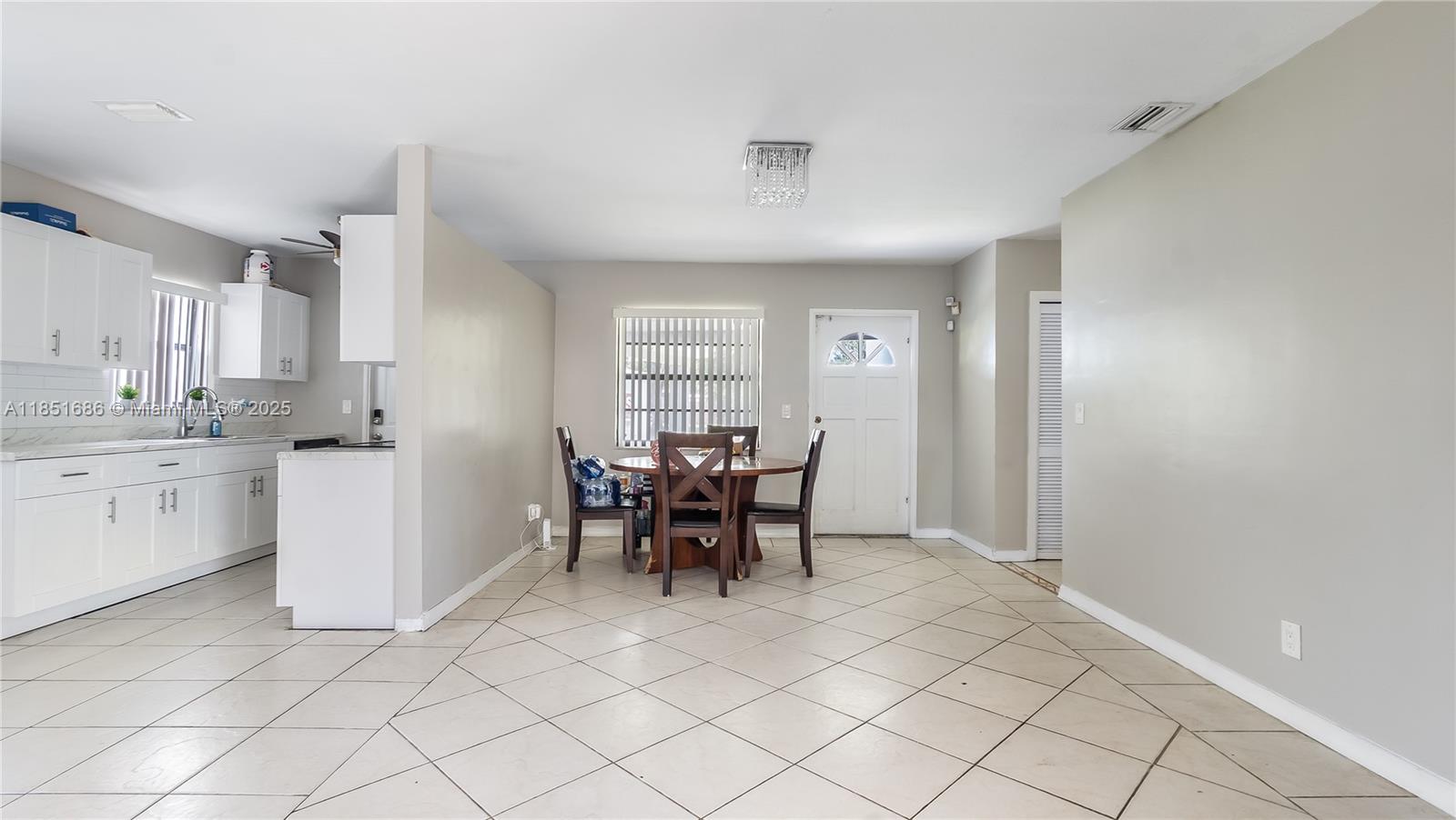 6528 Southwest 26th Street Miramar, FL 33023 - Photo 6 of 29 a dining room with furniture and window