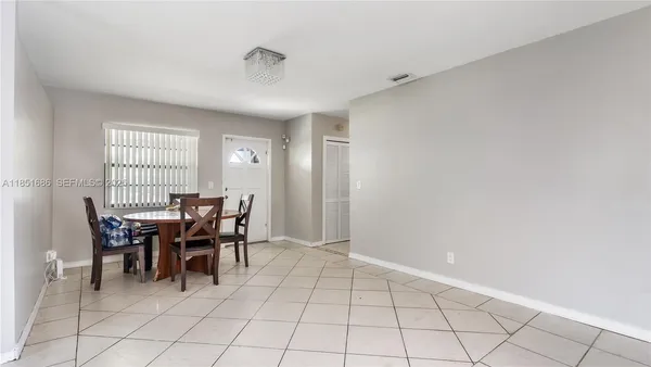 a view of a livingroom with furniture and window