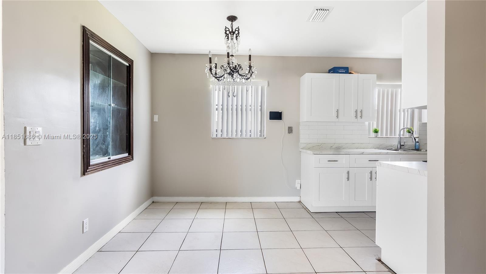 6528 Southwest 26th Street Miramar, FL 33023 - Photo 10 of 29 a bathroom with a sink a toilet and mirror