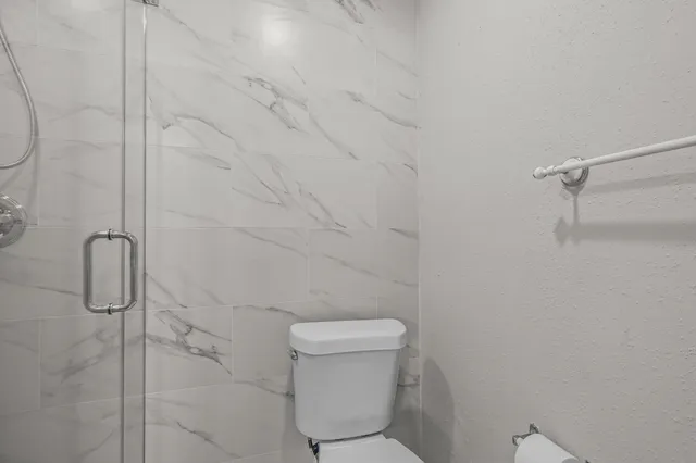 a bathroom with a granite countertop sink a large mirror and a vanity