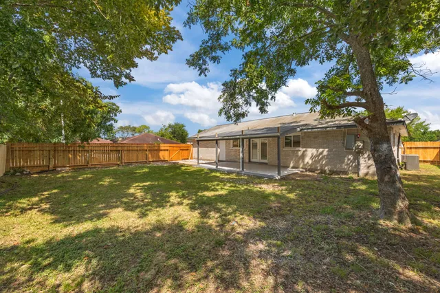 front view of a house with a big yard